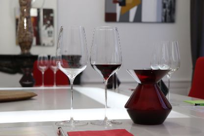 Professional wine tasting setup with elegant stemware and a red spittoon for a Burgundy wine foundations course in Beaune.