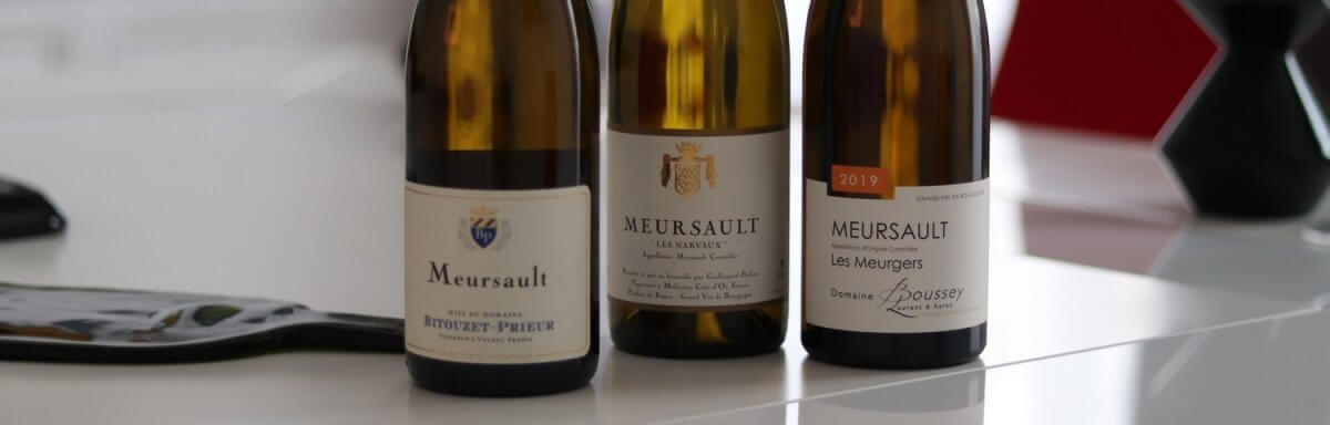 Three bottles of Meursault lined up for a horizontal tasting comparison